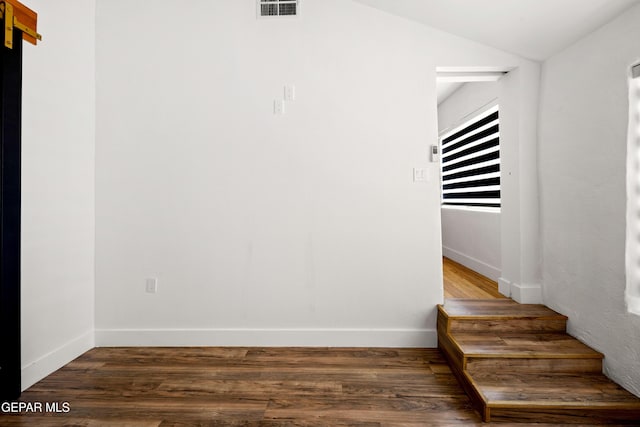 721 Mesita Dr, El Paso, TX 79902 - stairway with wood finished floors and lofted ceiling