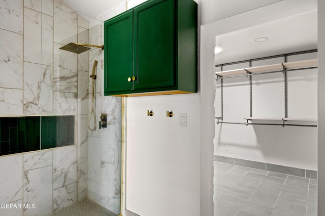 721 Mesita Dr, El Paso, TX 79902 - full bathroom featuring a marble finish shower and marble look tiles