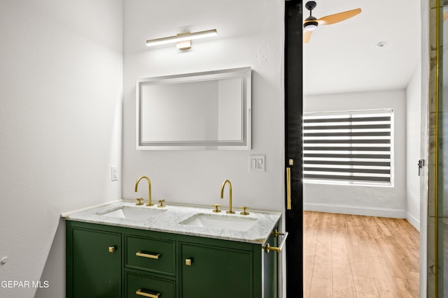 721 Mesita Dr, El Paso, TX 79902 - bathroom featuring double vanity, wood finished floors, and ceiling fan