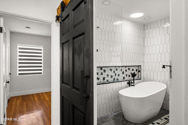 721 Mesita Dr, El Paso, TX 79902 - bathroom with a freestanding tub and wood finished floors