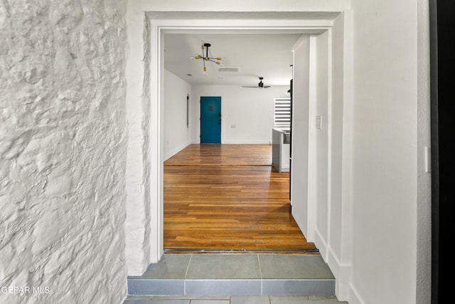 721 Mesita Dr, El Paso, TX 79902 - hallway with a chandelier and tile patterned flooring