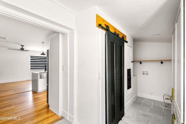 721 Mesita Dr, El Paso, TX 79902 - hall with a barn door and baseboards