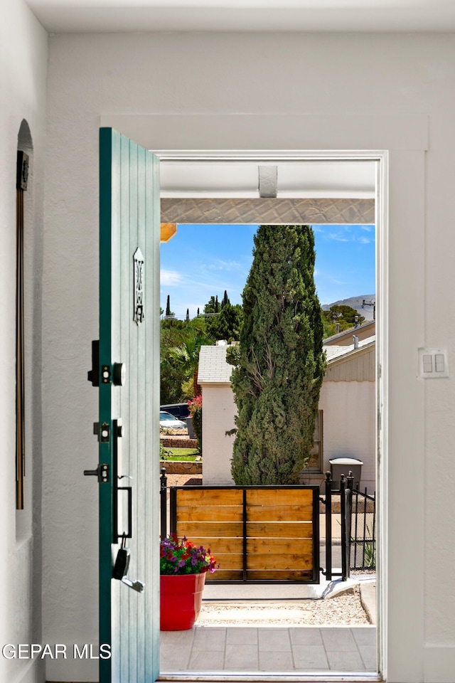 721 Mesita Dr, El Paso, TX 79902 - doorway to outside featuring tile patterned floors