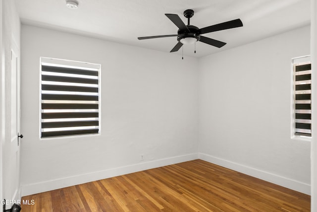 721 Mesita Dr, El Paso, TX 79902 - empty room featuring a smoke detector, a ceiling fan, and wood finished floors