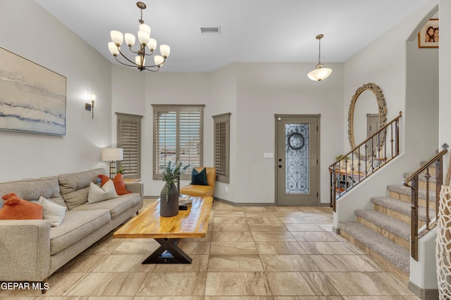 7817 Enchanted Trail Dr, El Paso, TX 79911 - living room featuring a chandelier and stairway