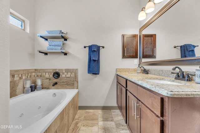 7817 Enchanted Trail Dr, El Paso, TX 79911 - full bathroom featuring a tub with jets and double vanity