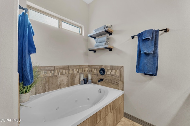 7817 Enchanted Trail Dr, El Paso, TX 79911 - full bath featuring a tub with jets and tile patterned floors