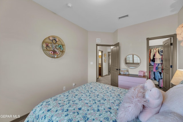 7817 Enchanted Trail Dr, El Paso, TX 79911 - bedroom with carpet floors and a walk in closet