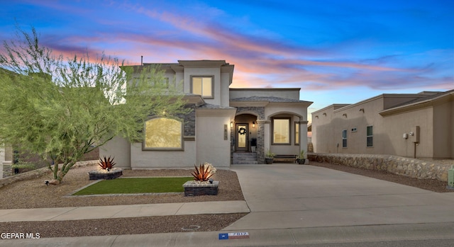 7817 Enchanted Trail Dr, El Paso, TX 79911 - mediterranean / spanish-style home featuring stucco siding and concrete driveway