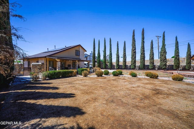 11713 Queens Garden Cir, El Paso, TX 79936 - rear view of property with solar panels and a gate
