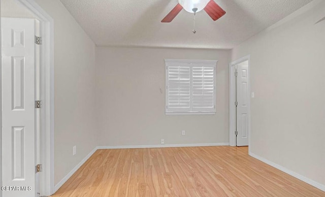 11713 Queens Garden Cir, El Paso, TX 79936 - empty room with light wood-style flooring, a ceiling fan, and a textured ceiling