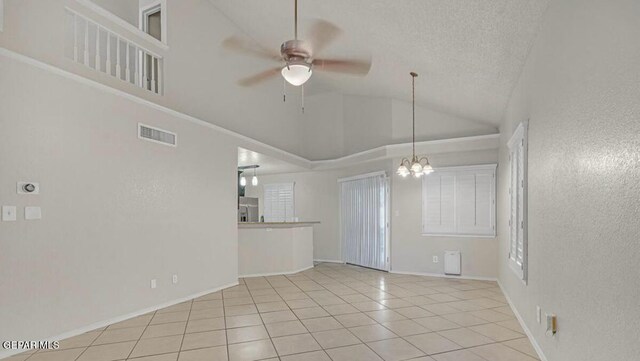 11713 Queens Garden Cir, El Paso, TX 79936 - unfurnished room featuring tile patterned flooring, a ceiling fan, a chandelier, a textured ceiling, and high vaulted ceiling