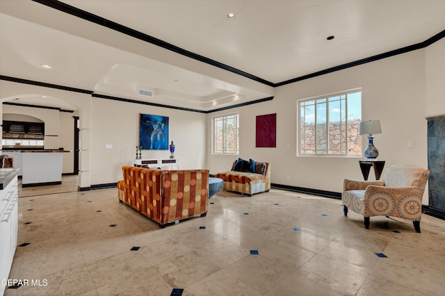 4540 N Stanton St, El Paso, TX 79902 - living room featuring ornamental molding, a tray ceiling, arched walkways, and recessed lighting