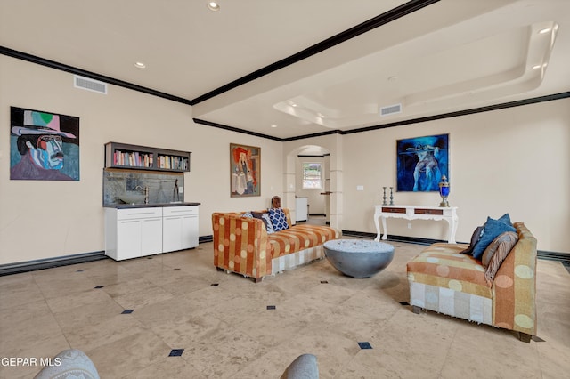 4540 N Stanton St, El Paso, TX 79902 - living room with crown molding, arched walkways, a raised ceiling, recessed lighting, and light tile patterned floors