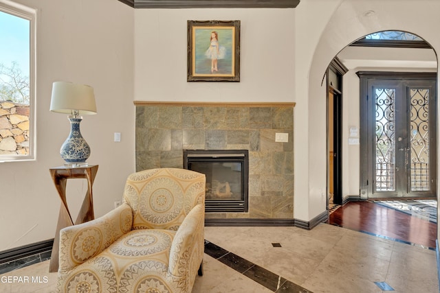 4540 N Stanton St, El Paso, TX 79902 - entryway with arched walkways, inlaid floor details, plenty of natural light, and a tile fireplace