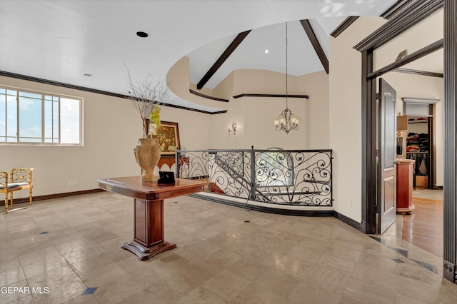 4540 N Stanton St, El Paso, TX 79902 - hallway with a chandelier, ornamental molding, vaulted ceiling, and an upstairs landing