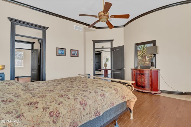 4540 N Stanton St, El Paso, TX 79902 - bedroom with wood finished floors, ornamental molding, and ceiling fan