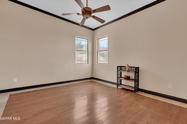 4540 N Stanton St, El Paso, TX 79902 - empty room with ornamental molding, a ceiling fan, and wood-type flooring