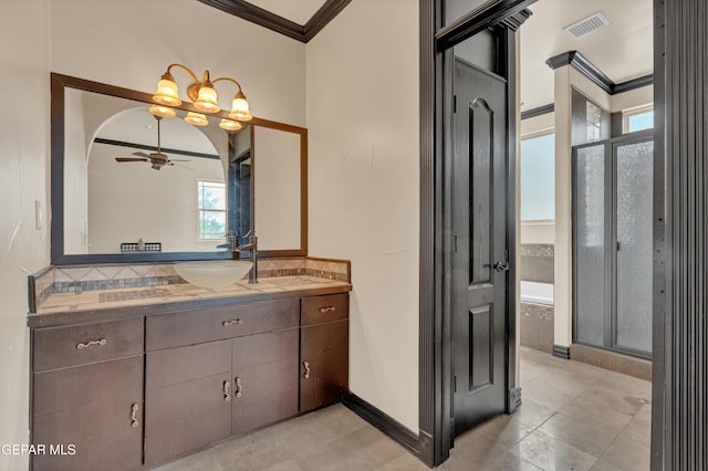 4540 N Stanton St, El Paso, TX 79902 - full bathroom featuring crown molding, vanity, a shower stall, a ceiling fan, and tiled tub