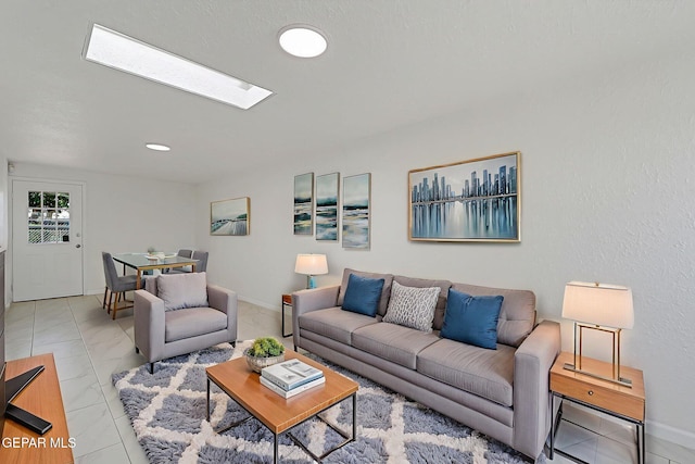 10304 Thor St, El Paso, TX 79924 - living room featuring a skylight and light marble finish floors