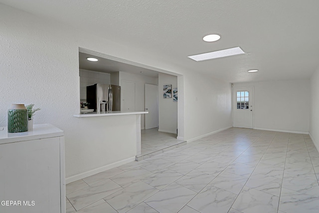 10304 Thor St, El Paso, TX 79924 - unfurnished room featuring light marble finish floors, recessed lighting, and a textured ceiling