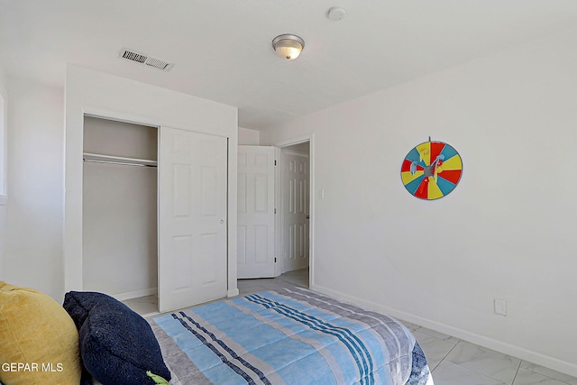 10304 Thor St, El Paso, TX 79924 - bedroom with a closet and light marble finish floors
