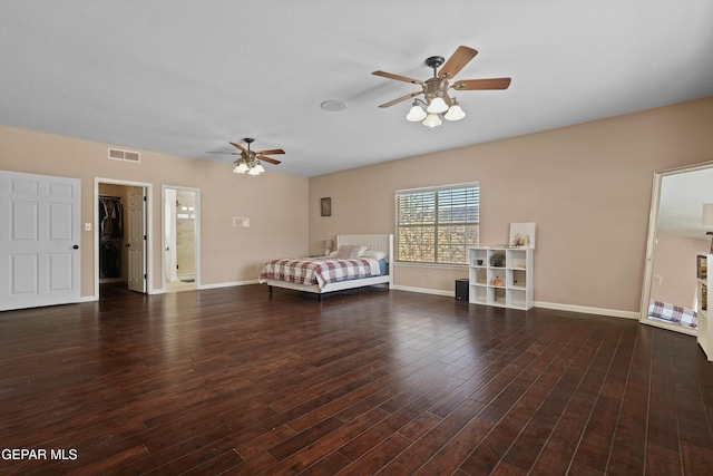 2072 Pueblo Nuevo Cir, El Paso, TX 79936 - bedroom with a spacious closet, wood finished floors, and a ceiling fan