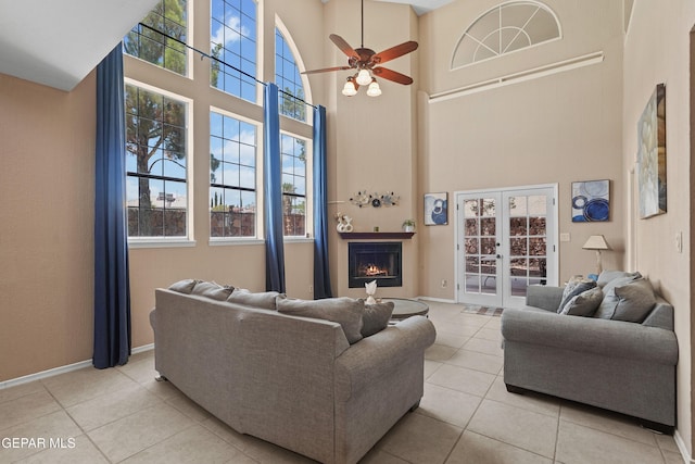 2072 Pueblo Nuevo Cir, El Paso, TX 79936 - living room with a high ceiling, tile patterned floors, french doors, and plenty of natural light