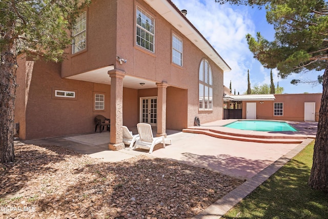 2072 Pueblo Nuevo Cir, El Paso, TX 79936 - back of property featuring a patio, french doors, an outdoor pool, and stucco siding