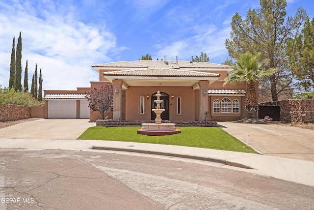 2072 Pueblo Nuevo Cir, El Paso, TX 79936 - mediterranean / spanish home featuring stucco siding, driveway, and a tiled roof