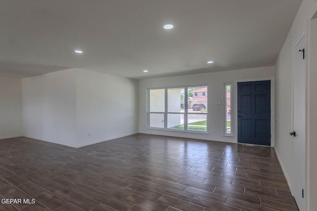 1605 Larry Wadkins Dr, El Paso, TX 79936 - empty room featuring dark wood-style flooring and recessed lighting