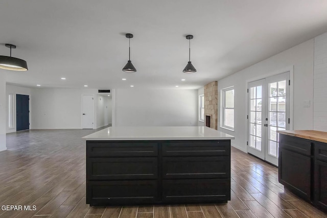 1605 Larry Wadkins Dr, El Paso, TX 79936 - kitchen featuring dark wood-style floors, pendant lighting, recessed lighting, french doors, and open floor plan