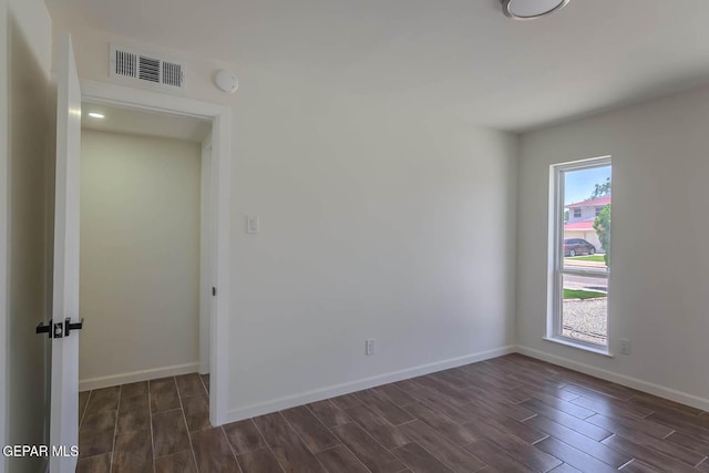 1605 Larry Wadkins Dr, El Paso, TX 79936 - spare room featuring wood tiled floors and a smoke detector