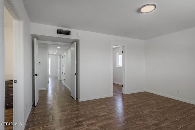 1605 Larry Wadkins Dr, El Paso, TX 79936 - unfurnished room with dark wood-style flooring and recessed lighting