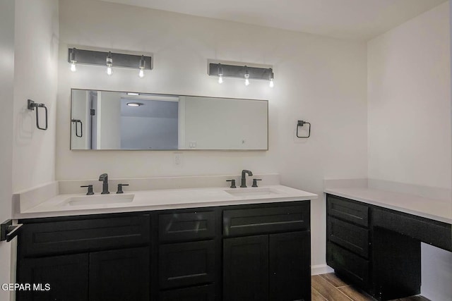1605 Larry Wadkins Dr, El Paso, TX 79936 - full bath featuring double vanity and wood finished floors