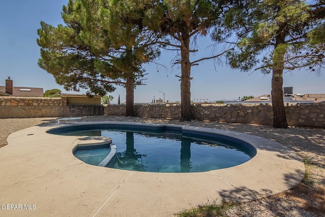 1605 Larry Wadkins Dr, El Paso, TX 79936 - view of pool featuring a fenced backyard, a patio area, a diving board, and a pool with connected hot tub