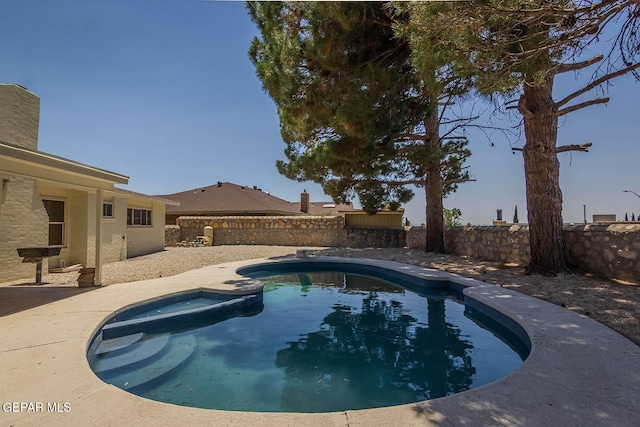 1605 Larry Wadkins Dr, El Paso, TX 79936 - view of swimming pool with a fenced backyard, a patio area, and a pool with connected hot tub