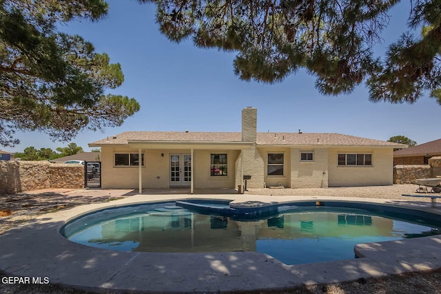 1605 Larry Wadkins Dr, El Paso, TX 79936 - view of pool with french doors, an outdoor hot tub, and a patio