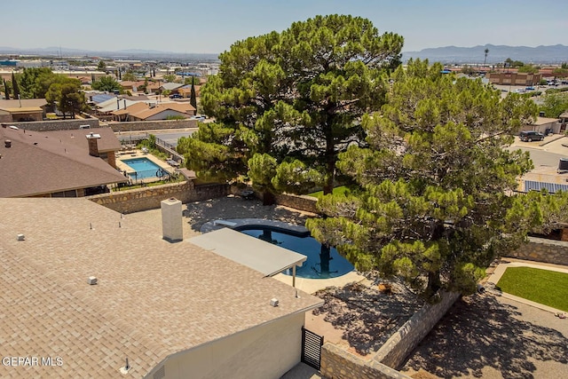 1605 Larry Wadkins Dr, El Paso, TX 79936 - drone / aerial view of a pool area and a mountain backdrop