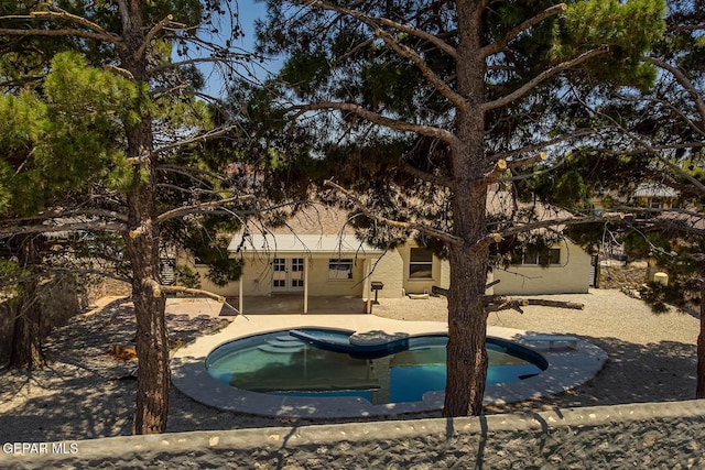 1605 Larry Wadkins Dr, El Paso, TX 79936 - swimming pool featuring french doors and a patio