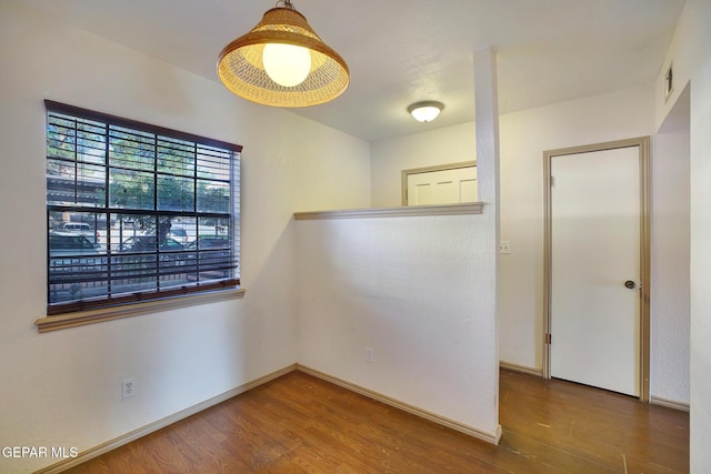 417 Irondale Dr Unit M, El Paso, TX 79912 - empty room featuring wood finished floors and baseboards