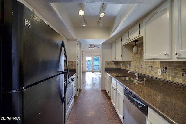 417 Irondale Dr Unit M, El Paso, TX 79912 - kitchen featuring stainless steel appliances, backsplash, a raised ceiling, and white cabinetry