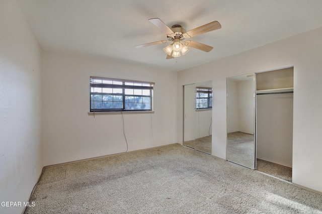 417 Irondale Dr Unit M, El Paso, TX 79912 - unfurnished bedroom featuring multiple closets, carpet flooring, and ceiling fan