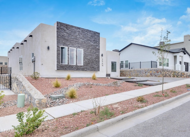 7549 Enchanted Park Dr 706849, El Paso, TX 79911 - modern home featuring stone siding and stucco siding