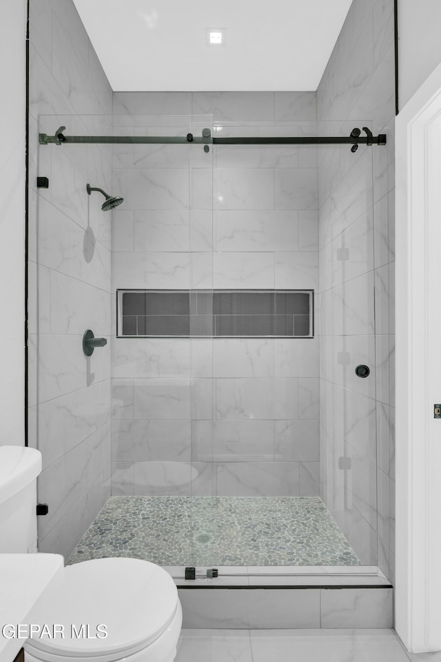 7549 Enchanted Park Dr 706849, El Paso, TX 79911 - full bathroom featuring a shower stall and toilet