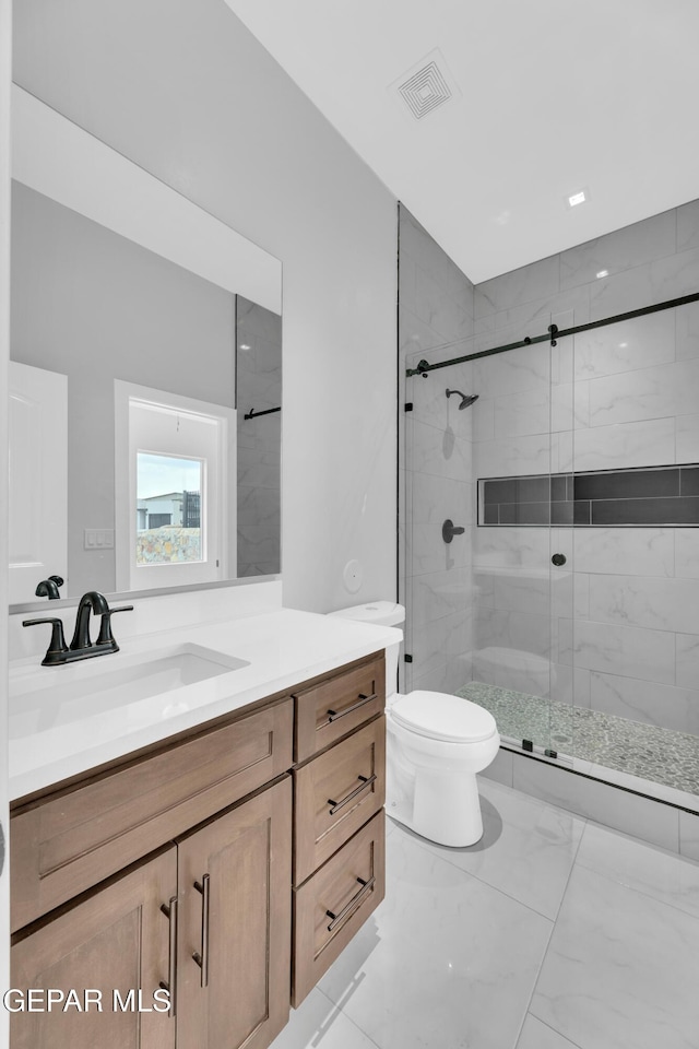7549 Enchanted Park Dr 706849, El Paso, TX 79911 - full bathroom with vanity, a stall shower, and marble look tiles
