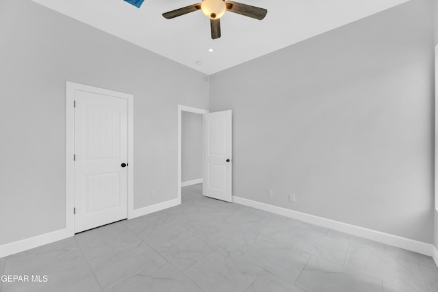 7549 Enchanted Park Dr 706849, El Paso, TX 79911 - unfurnished bedroom with marble look tile flooring and a ceiling fan