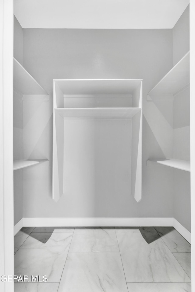 7549 Enchanted Park Dr 706849, El Paso, TX 79911 - spacious closet featuring marble look tiles