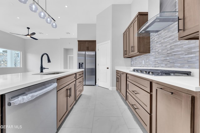 7549 Enchanted Park Dr 706849, El Paso, TX 79911 - kitchen featuring stainless steel appliances, wall chimney exhaust hood, light marble finish flooring, decorative backsplash, and light countertops