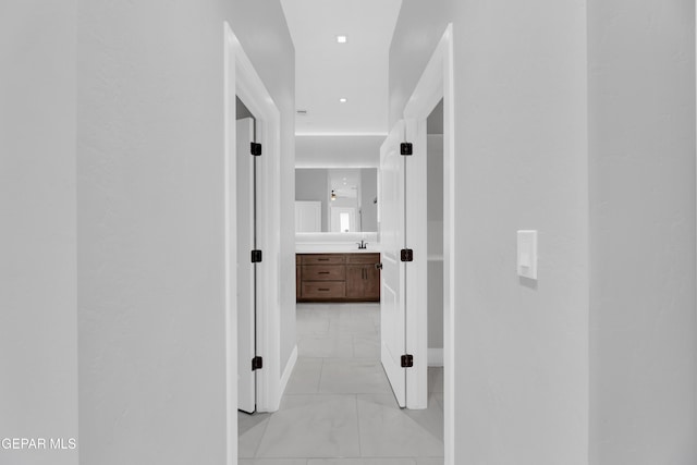 7549 Enchanted Park Dr 706849, El Paso, TX 79911 - hall featuring light marble finish flooring and baseboards